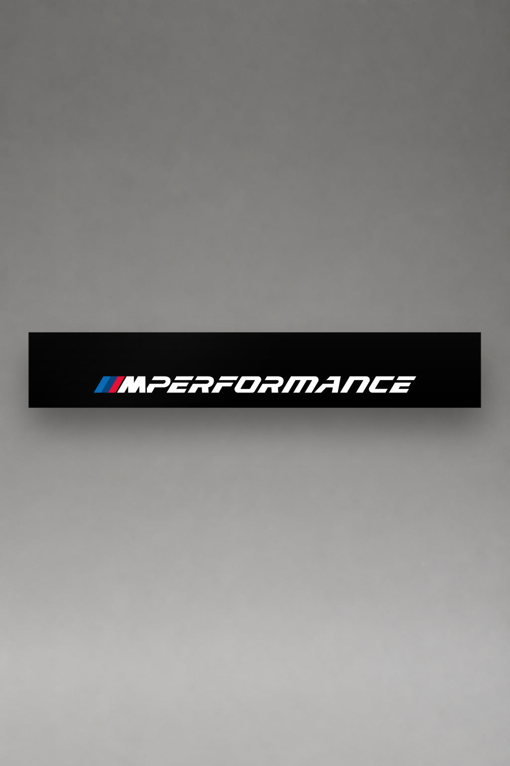 Parasol de vinilo BMW M Performance · Línea Factory Tuning, la tira entera de 150 x 25 cm vista de frente, de MOA-Grafics.