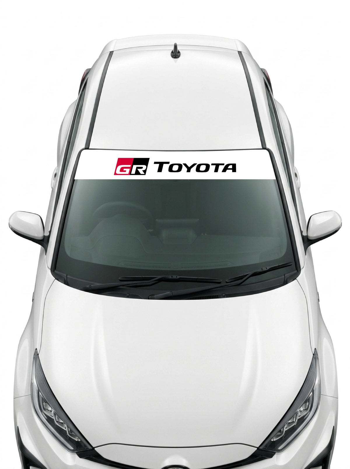 Coche con el parasol de vinilo Toyota blanco con el emblema GR y el lettering TOYOTA en negro instalado en el parabrisas