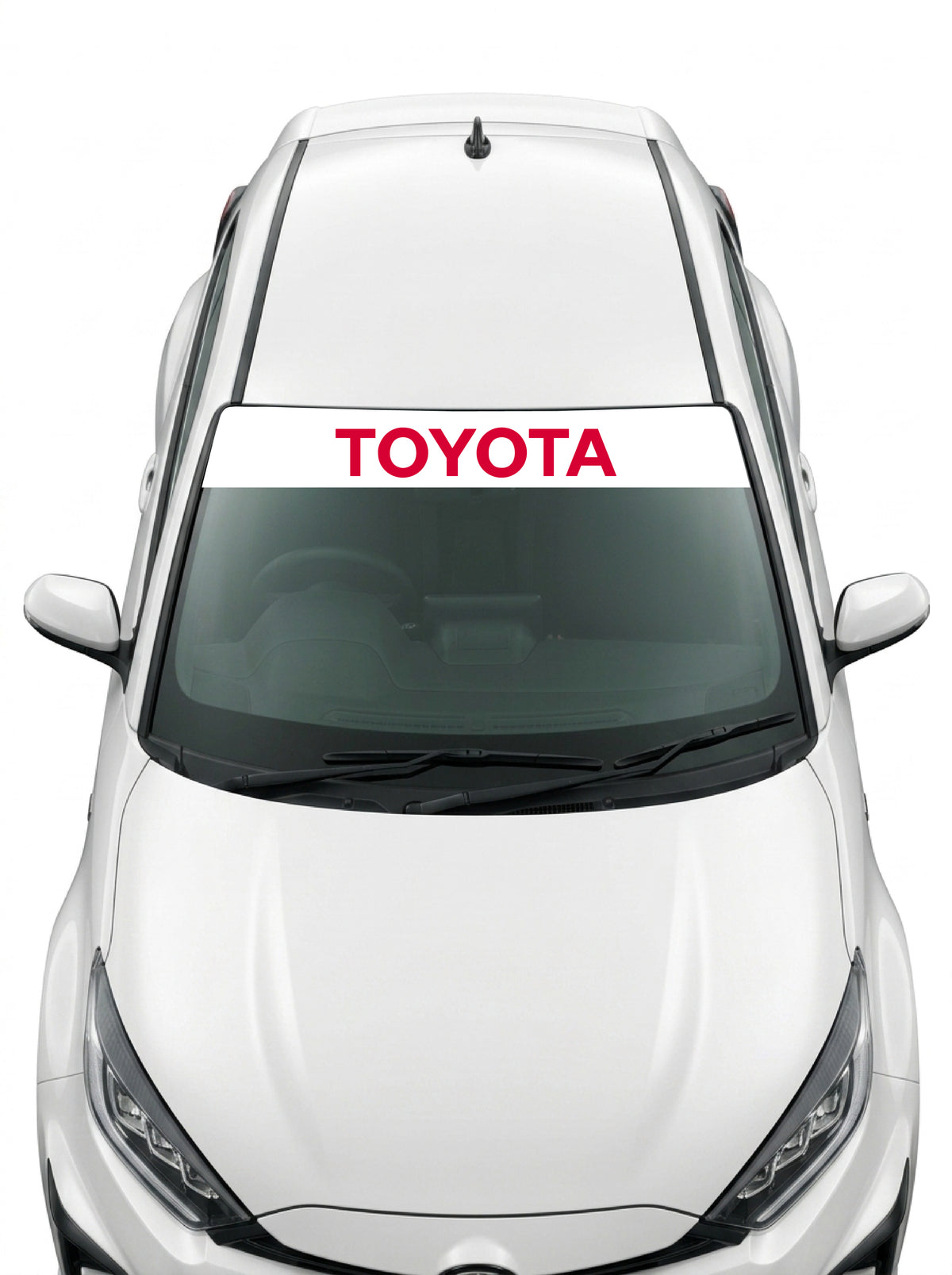 Coche con el parasol de vinilo Toyota blanco con el lettering TOYOTA en rojo instalado en el parabrisas