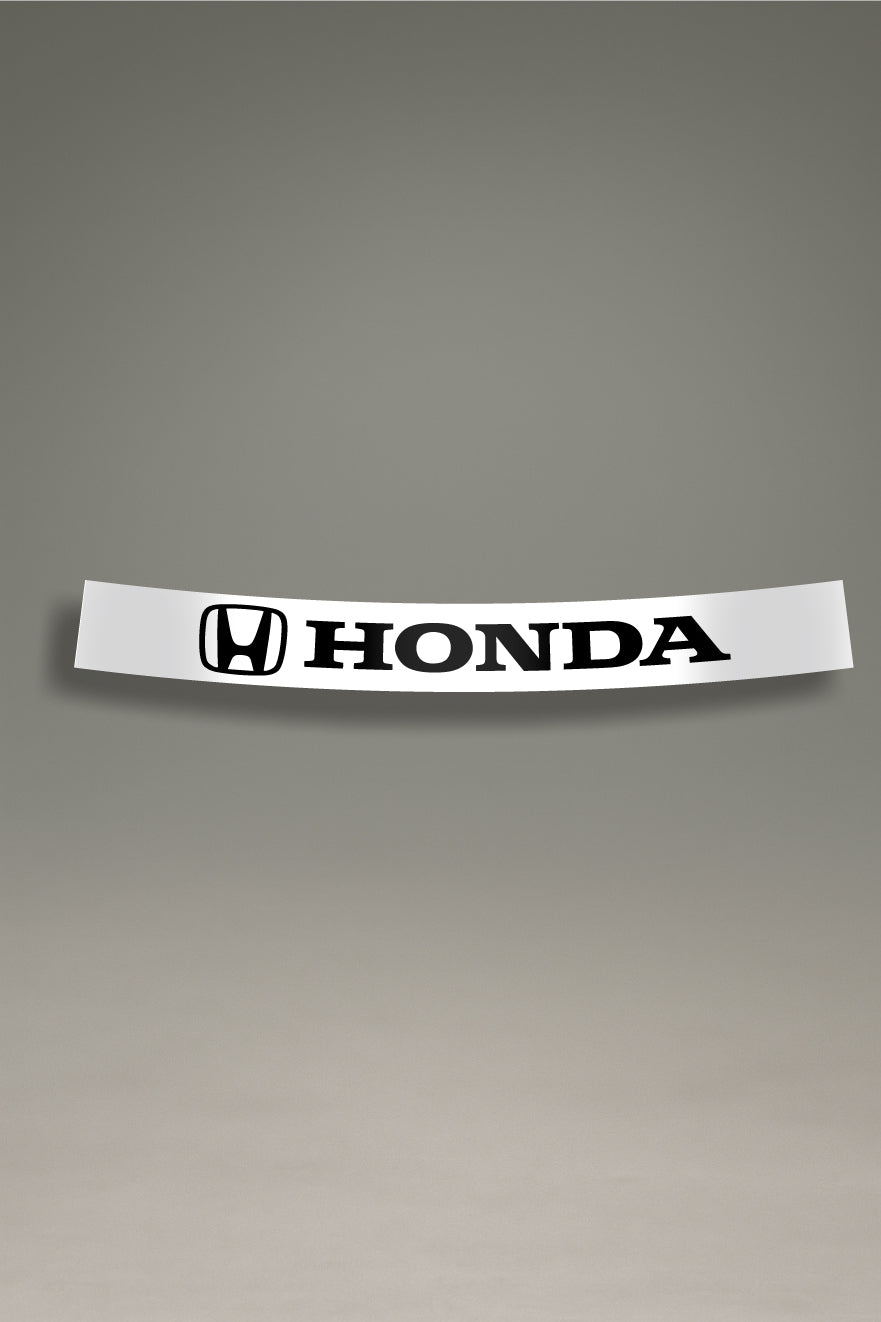 Parasol de vinilo blanco con el logotipo oficial de Honda en negro. Un accesorio de personalización de MOA-Grafics para proteger el parabrisas del sol.