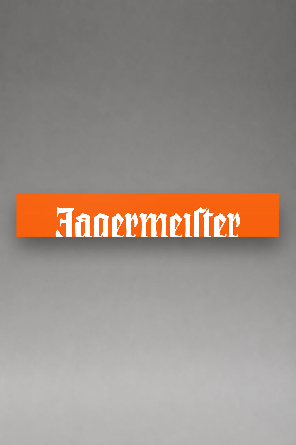 Parasol de vinilo Jagermeister naranja con el lettering gotico de la marca en blanco, la tira entera de 150 x 25 cm vista de frente, de MOA-Grafics.