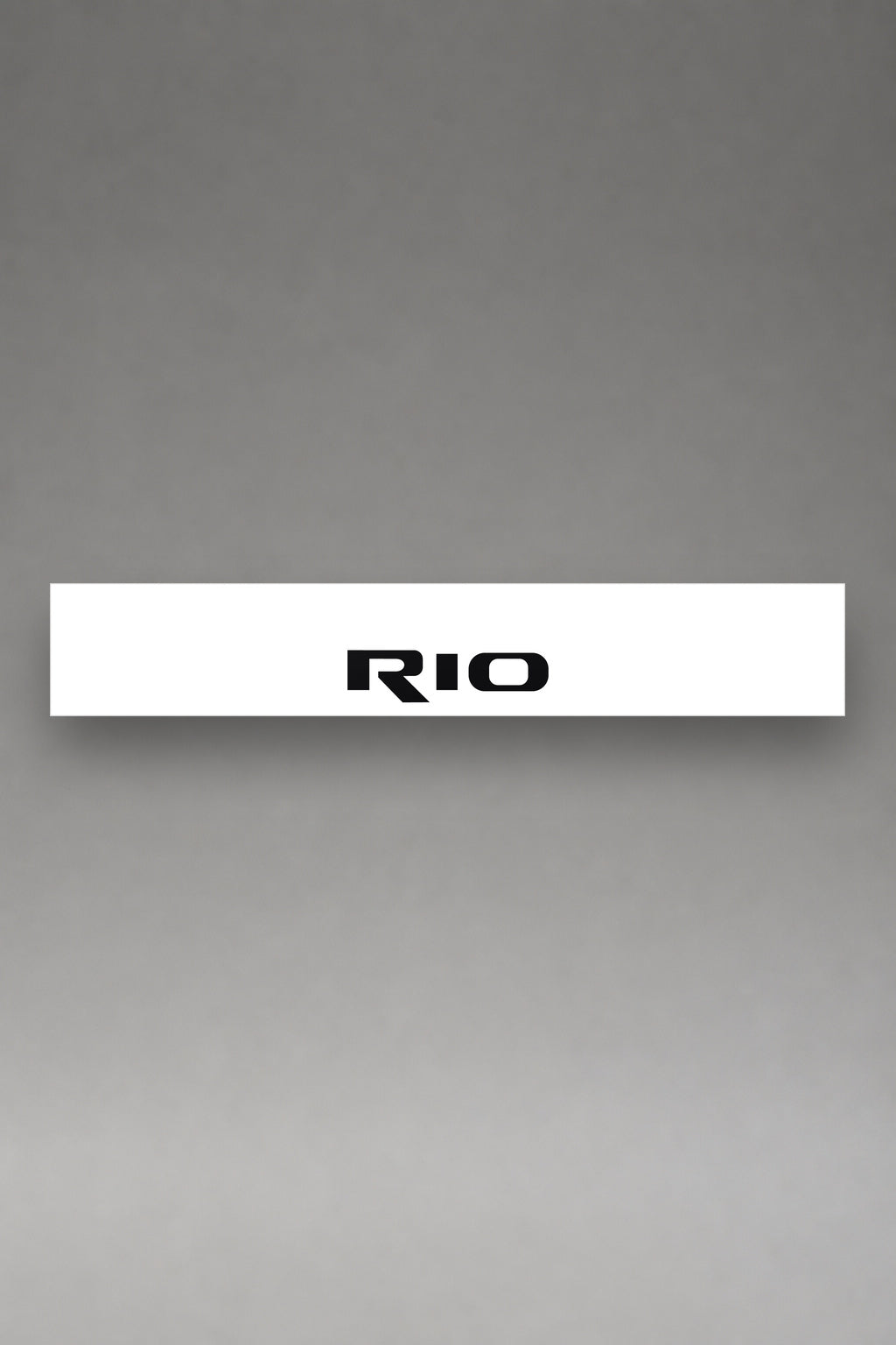 Parasol de vinilo Kia Rio · Lettering Modelo Urbano, la tira entera de 150 x 25 cm vista de frente, de MOA-Grafics.