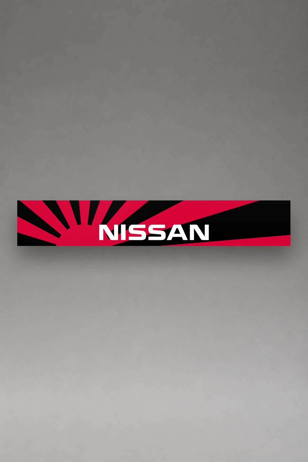Parasol de vinilo Nissan negro con las lineas de velocidad en rojo, la tira entera vista de frente, de MOA-Grafics.