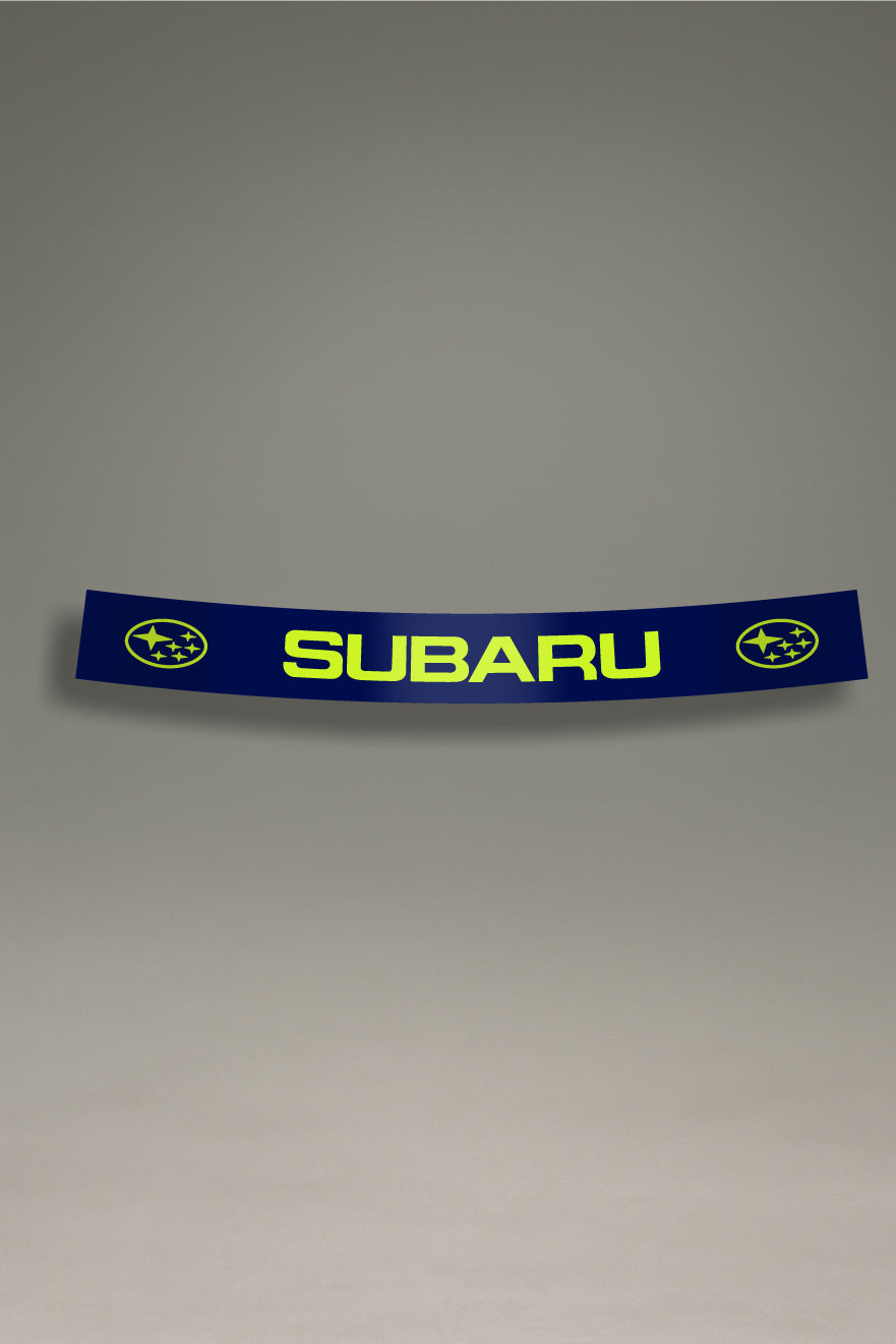 Parasol azul para parabrisas con el logo clásico de Subaru en color lima, una pieza de estilo JDM para la personalización y tuning de MOA-Grafics.