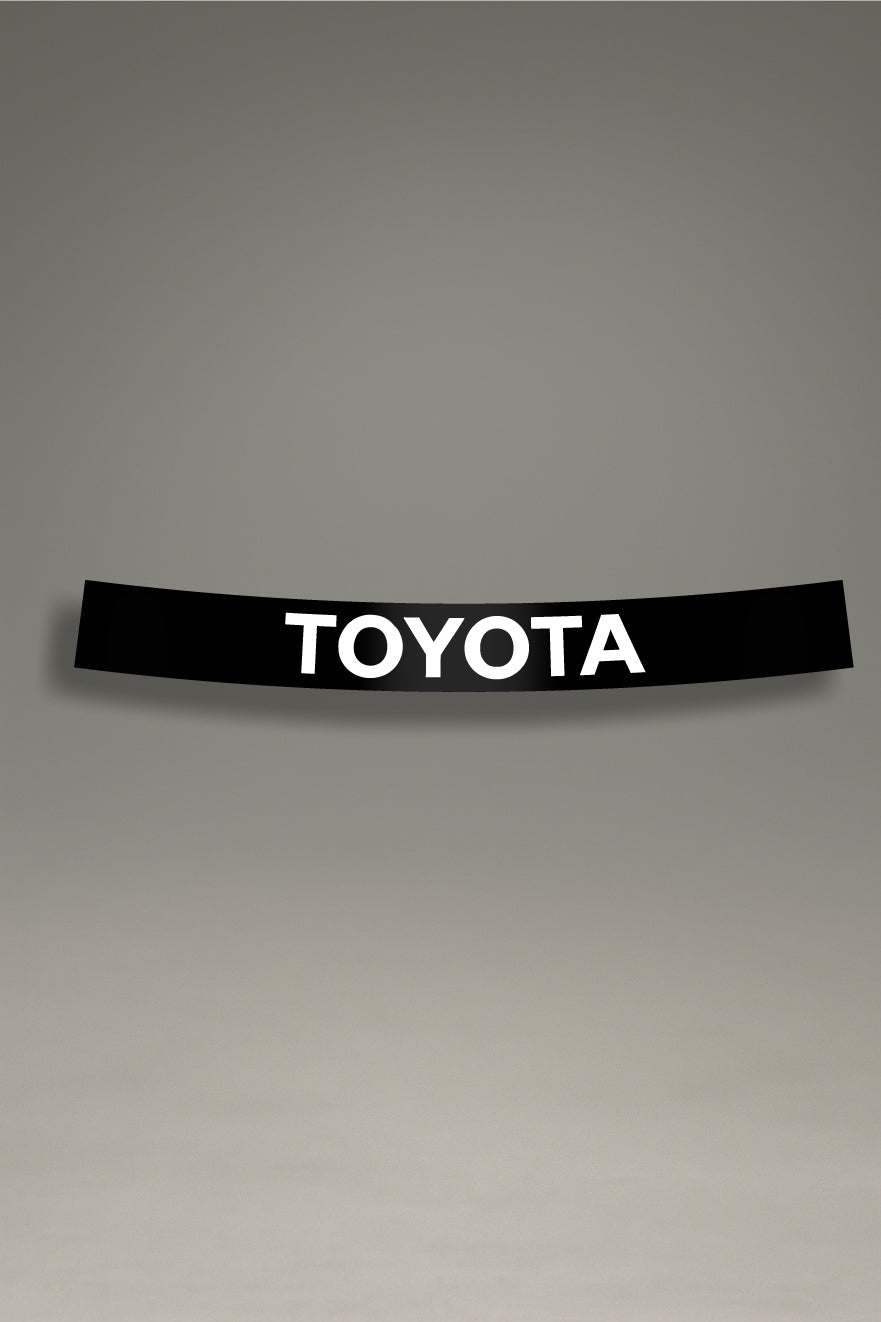 Parasol negro para parabrisas con el logo de Toyota en blanco, un accesorio de estilo JDM para personalización de coches de MOA-Grafics.