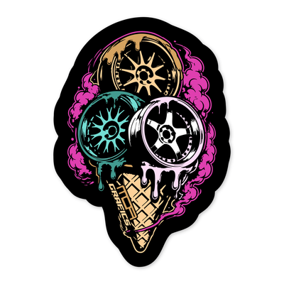 Diseño plano de un cucurucho de gofre con tres bolas que son llantas: una dorada de radios finos arriba, una turquesa a la izquierda y una blanca y rosa de cinco radios a la derecha, derritiéndose sobre el barquillo, con el rótulo MOA GRAFICS en el canto y humo rosa detrás.