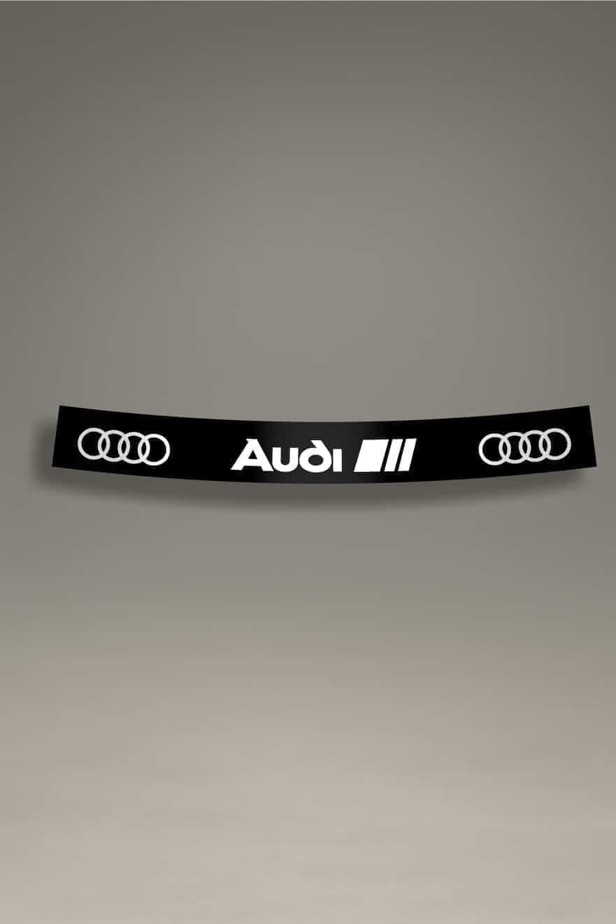  Parasol de vinilo para Audi RS en color negro y blanco con los aros de Audi y el logo de la serie RS. Accesorio esencial para el estilo JDM y la cultura tuning.