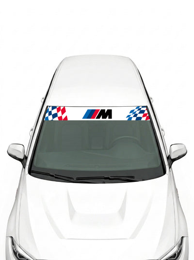 Parasol de vinilo BMW M blanco con bandera a cuadros a ambos lados y logo M en el centro, instalado en el parabrisas de un coche blanco