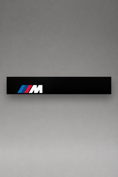 Parasol de vinilo BMW M · Logo de la División Deportiva Oficial, la tira entera de 150 x 25 cm vista de frente, de MOA-Grafics.