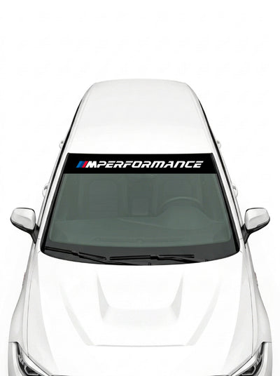 Parasol de vinilo BMW M Performance negro con el lettering MPerformance en blanco, instalado en el parabrisas de un coche blanco