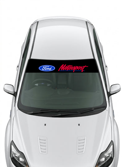 Parasol de vinilo Ford Motorsport negro con el ovalo y el lettering enmarcados en un sello racing, instalado en el parabrisas de un Ford blanco