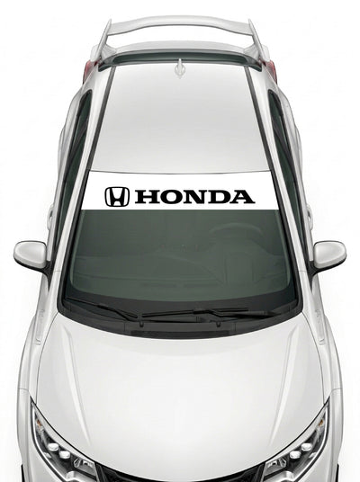 Parasol de vinilo Honda blanco con el emblema H y el lettering HONDA en negro, instalado en el parabrisas de un Honda Civic blanco