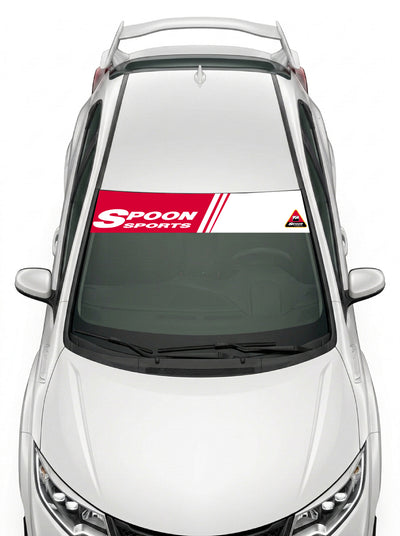 Parasol de vinilo Honda blanco con las franjas de Spoon Sports en rojo, instalado en el parabrisas de un Honda Civic blanco