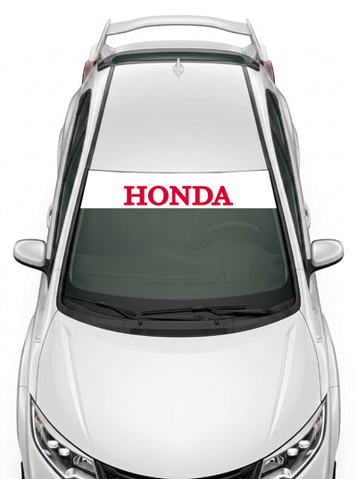 Parasol de vinilo Honda blanco con el lettering HONDA en rojo, instalado en el parabrisas de un Honda Civic blanco