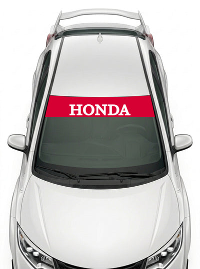 Parasol de vinilo Honda rojo con el lettering HONDA en blanco, instalado en el parabrisas de un Honda Civic blanco