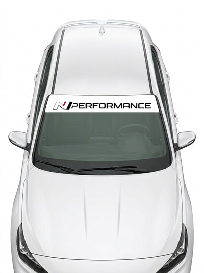 Parasol de vinilo Hyundai N Performance blanco con el lettering en negro, instalado en el parabrisas de un Hyundai blanco