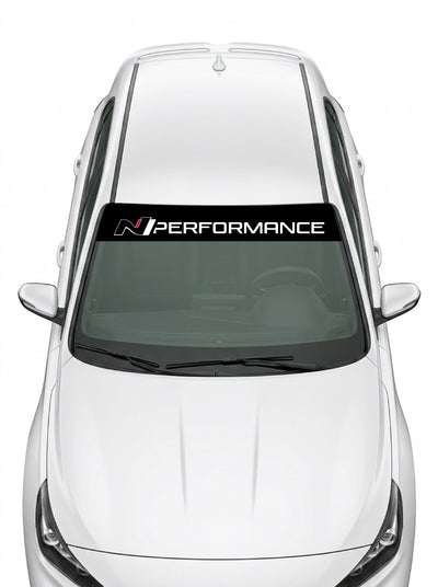 Parasol de vinilo Hyundai N Performance negro con el lettering en blanco, instalado en el parabrisas de un Hyundai blanco