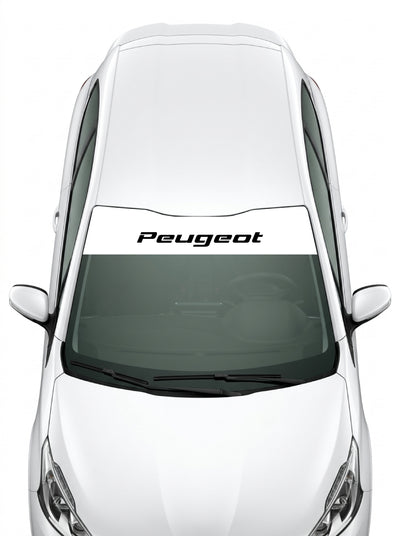 Coche con el parasol de vinilo Peugeot blanco con el lettering Peugeot en cursiva en negro instalado en el parabrisas