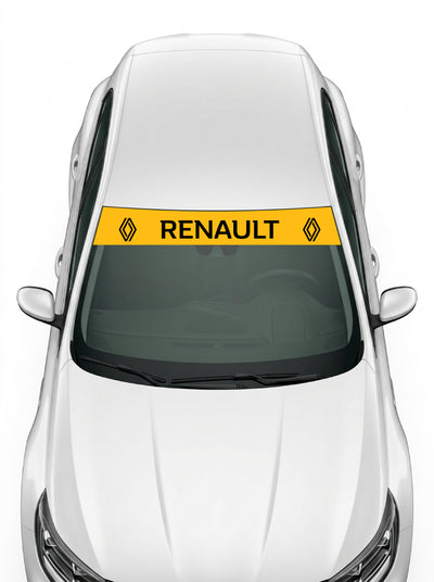 Coche con el parasol de vinilo Renault amarillo con el rombo de 2021 a los dos lados y el lettering RENAULT en negro instalado en el parabrisas