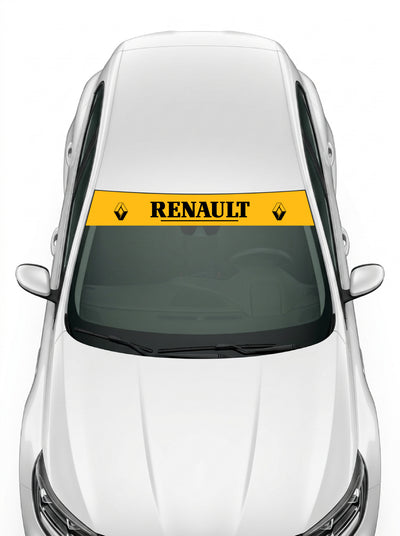 Coche con el parasol de vinilo Renault amarillo con el rombo de lineas a los dos lados y el lettering RENAULT serif subrayado en negro instalado en el parabrisas