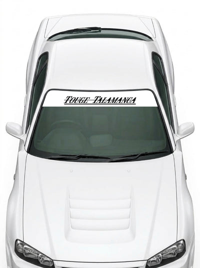 Coche con el parasol de vinilo Touge Talamanca blanco con el lettering TOUGE TALAMANCA en negro instalado en el parabrisas