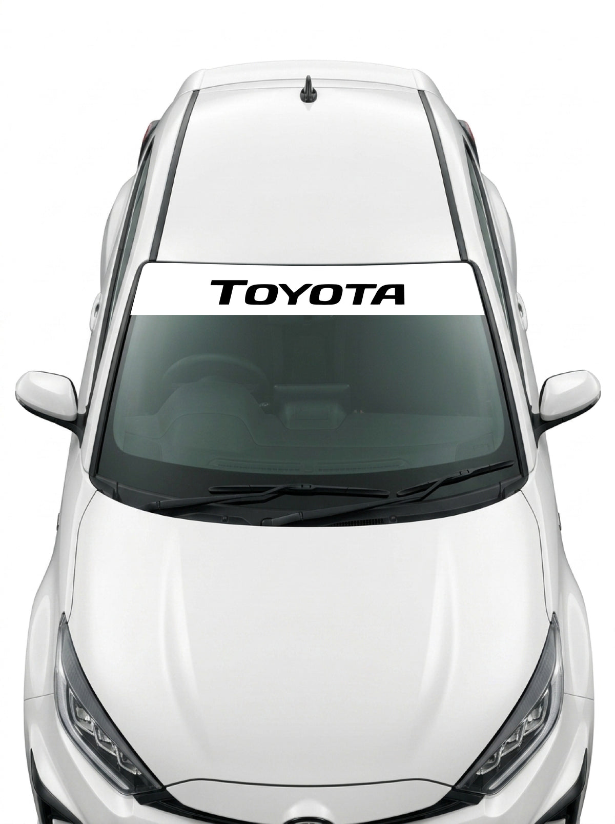 Coche con el parasol de vinilo Toyota blanco con el lettering TOYOTA en negro y tipografia italica estrecha instalado en el parabrisas