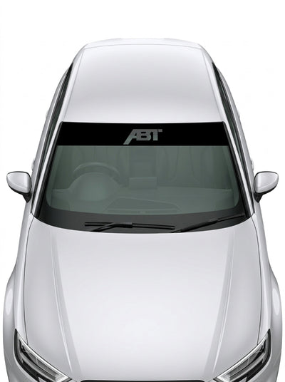 Parasol de vinilo Audi ABT de 150x25 cm en transparente con el lettering ABT Sportsline recortado, instalado en el parabrisas de un coche