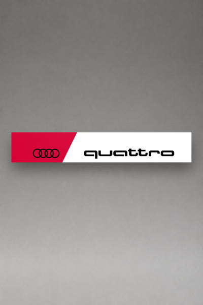Parasol de vinilo Audi Quattro blanco con la banda roja, los cuatro anillos y el lettering quattro en negro, la tira entera de 150 x 25 cm vista de frente, de MOA-Grafics.