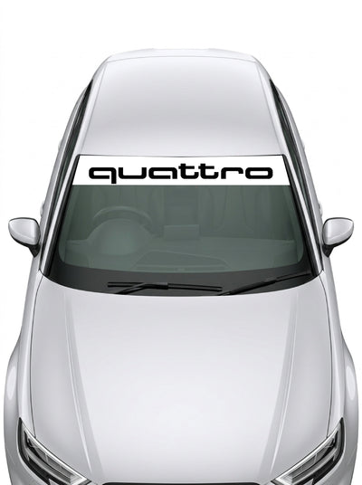 Parasol de vinilo Audi Quattro de 150x25 cm en blanco con la tipografia WRC del lettering quattro en negro, instalado en el parabrisas