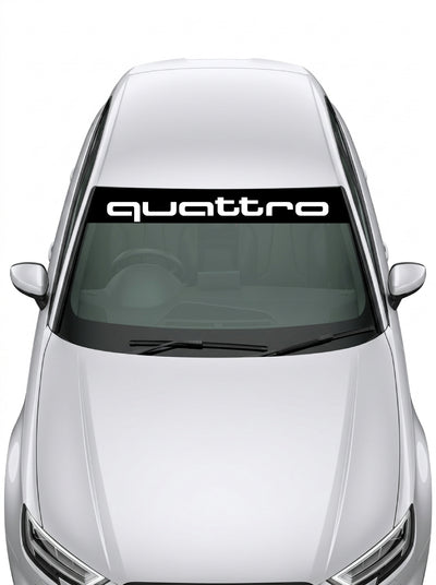 Parasol de vinilo Audi Quattro de 150x25 cm en negro con la tipografia WRC del lettering quattro en blanco, instalado en el parabrisas