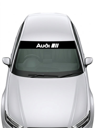 Parasol de vinilo Audi Sport de 150x25 cm en negro con el rotulo Audi y las tres barras en blanco, instalado en el parabrisas de un coche