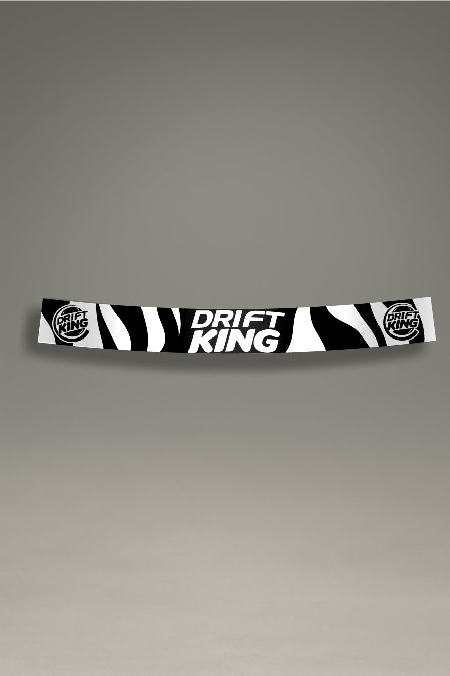 Parasol de vinilo con el logotipo de Drift King y un patrón de cebra en blanco y negro. Un accesorio de MOA-Grafics para personalizar coches de drift con un estilo JDM.
