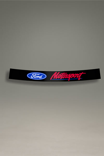 Parasol de vinilo negro con el logotipo de Ford y el texto 'Motorsport' en rojo y azul. Accesorio de personalización de MOA-Grafics para dar un toque racing a tu coche y protegerlo de los rayos UV.