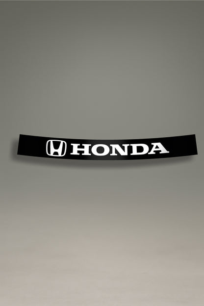 Parasol de vinilo negro con el logotipo oficial de Honda en blanco. Accesorio de MOA-Grafics para personalizar el coche con un estilo JDM y proteger el interior.