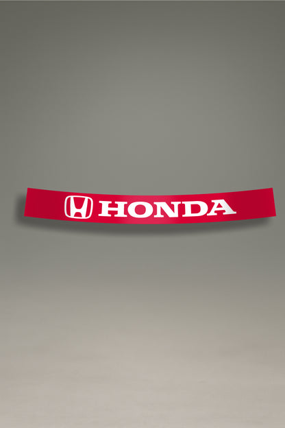 Parasol de vinilo rojo para coche con el logotipo oficial de Honda en blanco. Accesorio de MOA-Grafics para personalizar vehículos Honda y protegerlos de los rayos UV.