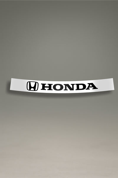Parasol de vinilo blanco con el logotipo oficial de Honda en negro. Un accesorio de personalización de MOA-Grafics para proteger el parabrisas del sol.