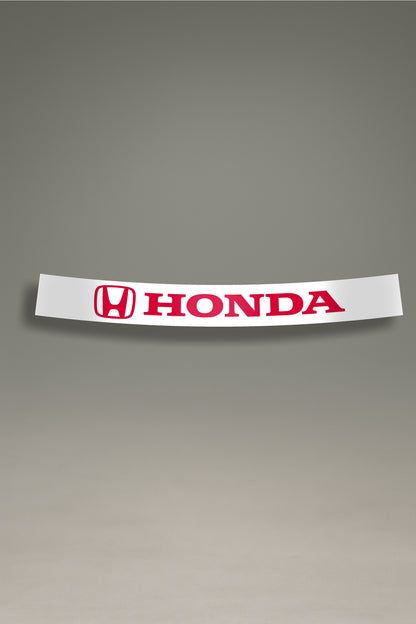 Parasol de vinilo blanco con el logotipo oficial de Honda en rojo. Un accesorio de MOA-Grafics para proteger el vehículo del sol con un diseño deportivo.