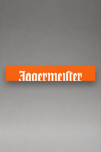 Parasol de vinilo Jagermeister naranja con el lettering gotico de la marca en blanco, la tira entera de 150 x 25 cm vista de frente, de MOA-Grafics.