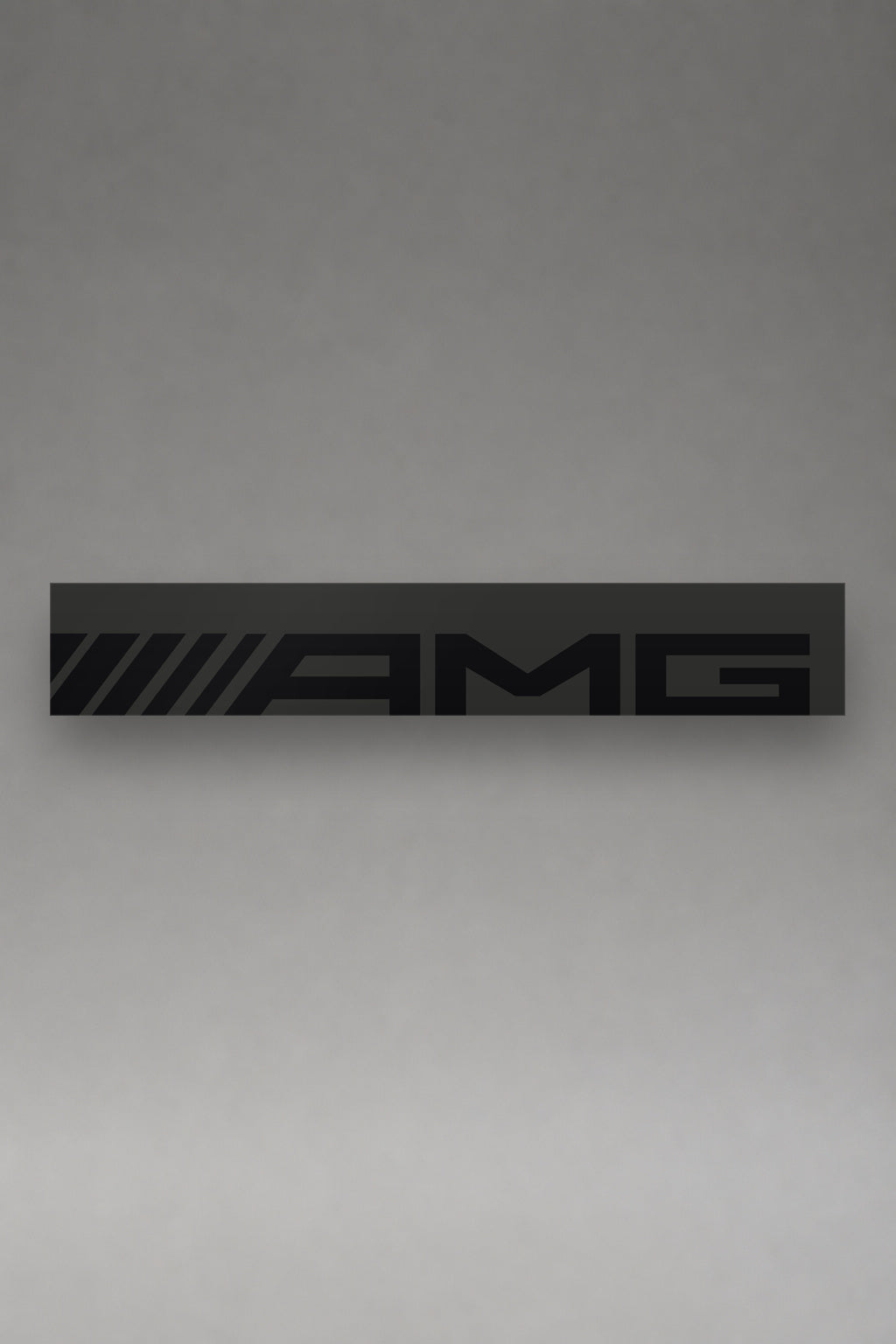 Parasol de vinilo Mercedes-AMG plata con el lettering AMG en negro, la tira entera de 150 x 25 cm vista de frente, de MOA-Grafics.