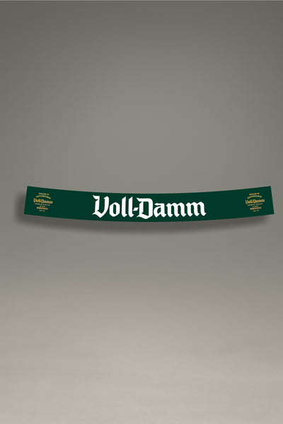 Parasol de vinilo verde con el logotipo premium de Voll-Damm en blanco. Un accesorio de MOA-Grafics para proteger el interior de tu coche con un estilo clásico.