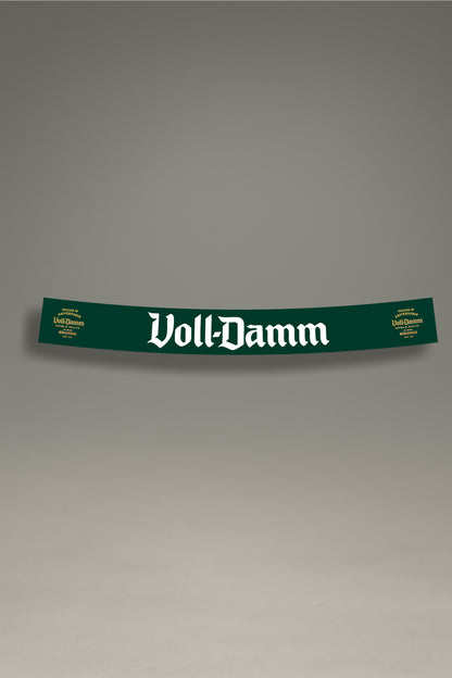 Parasol de vinilo verde con el logotipo premium de Voll-Damm en blanco. Un accesorio de MOA-Grafics para proteger el interior de tu coche con un estilo clásico.