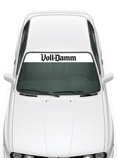 Coche con el parasol de vinilo Voll-Damm blanco con el lettering Voll-Damm en negro y tipografia gotica instalado en el parabrisas