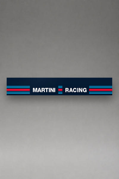 Parasol de vinilo Martini Racing azul marino con el lettering MARTINI RACING en blanco y los bloques de franjas a los lados, la tira entera vista de frente, de MOA-Grafics.