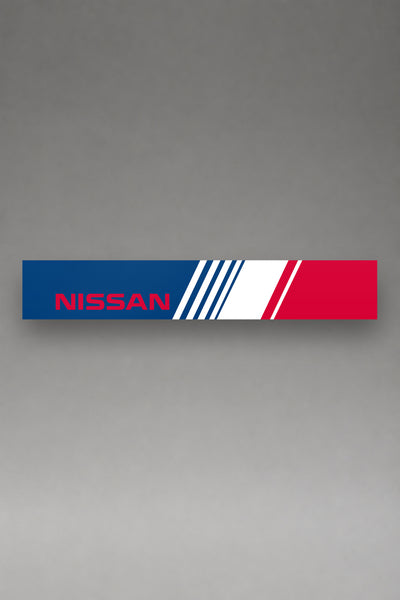 Parasol de vinilo Nissan con la livery lateral tricolor de los ochenta, la tira entera vista de frente, de MOA-Grafics.