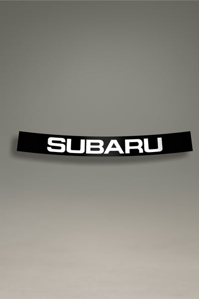 Parasol negro para parabrisas con el logo de Subaru en blanco, un accesorio de estilo JDM para la personalización de coches de MOA-Grafics.