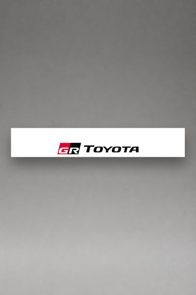 Parasol de vinilo Toyota blanco con el logotipo GR Toyota, la tira entera de 150 x 25 cm vista de frente, de MOA-Grafics.