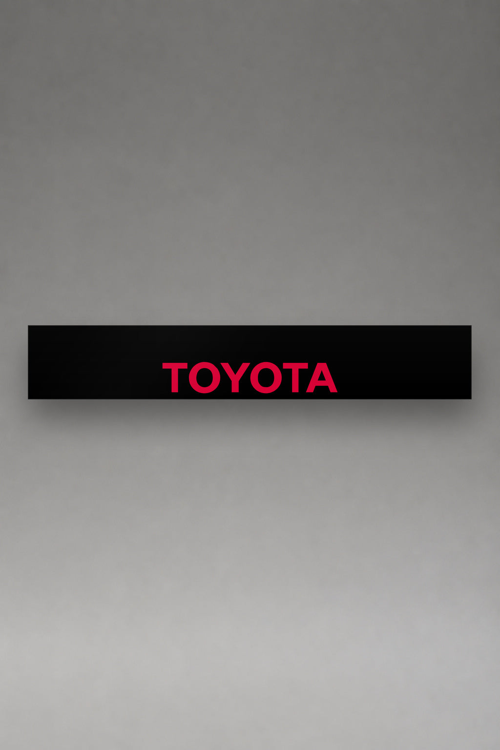 Parasol de vinilo Toyota · Emblema Tres Óvalos, la tira entera de 150 x 25 cm vista de frente, de MOA-Grafics.
