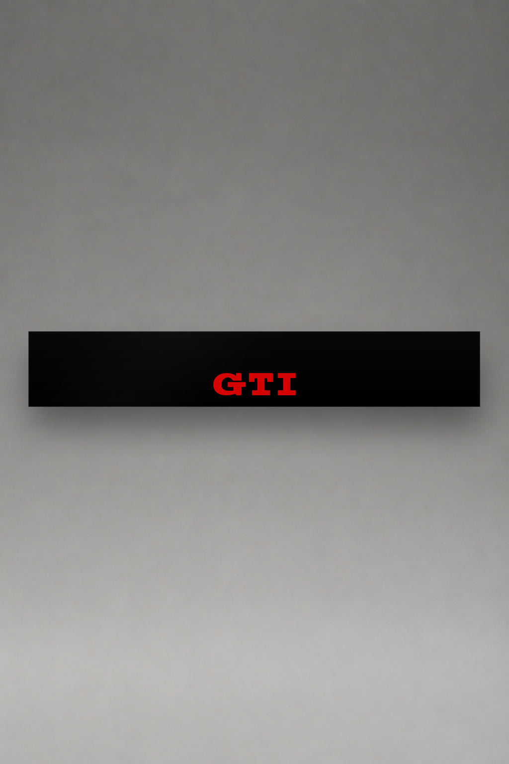 Parasol de vinilo Volkswagen · Tres Letras GTI, la tira entera de 150 x 25 cm vista de frente, de MOA-Grafics.